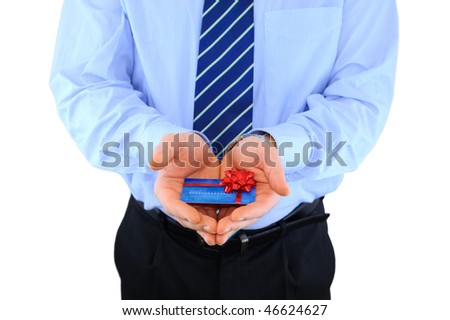 Professionally dressed businessman is giving a present credit card
