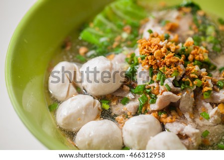 This is Kuy teav. It is a noodle soup consisting of rice noodles with beef stock and toppings.