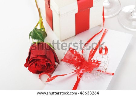 beautiful red rose, champagne  and  letter close up