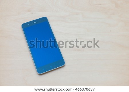 smart phone on wooden place with copy space