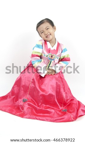 Little girl asian in korea costume isolated on white background.