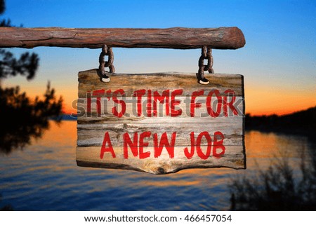 It's time for a new job motivational phrase sign on old wood with blurred background
