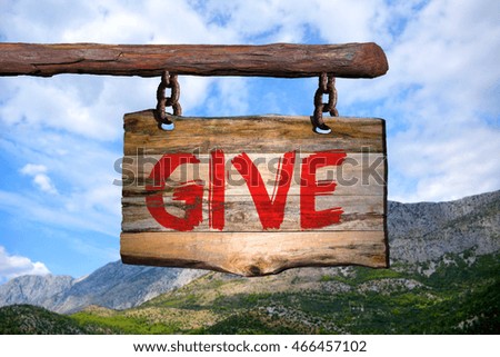 Give motivational phrase sign on old wood with blurred background