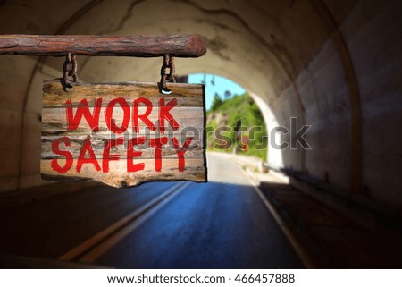 Work safety motivational phrase sign on old wood with blurred background