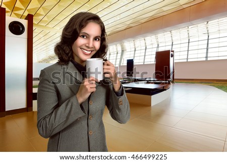 Closeup portrait of beautiful asian woman holding cup of coffee