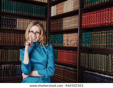 Business smart lawyer lady near bookcase