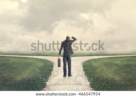 indecisive man and lost chooses the right path Royalty-Free Stock Photo #466547954