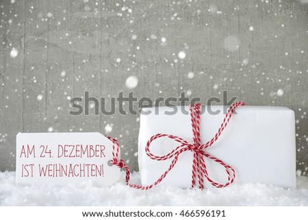 Chalkboard With German Text Frohe Weihnachten Und Ein Gutes Neues Jahr Means Merry Christmas And Happy New Year. Christmas Tree With Red Balls. Gifts Or Presents In The Front Of Wooden Background. 