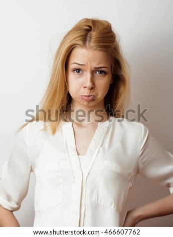 young blond woman on white backgroung smiling gesture thumbs up, isolated emotional posing close up, lifestyle people concept