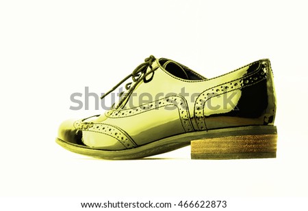 Footwear Concept. Horizontal Image. Pair of yellow female classic leather shoes on the white background.