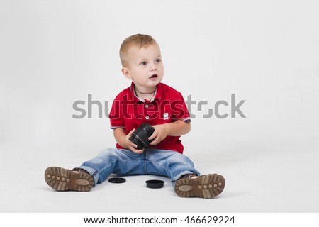 child plays Camera Lenses
