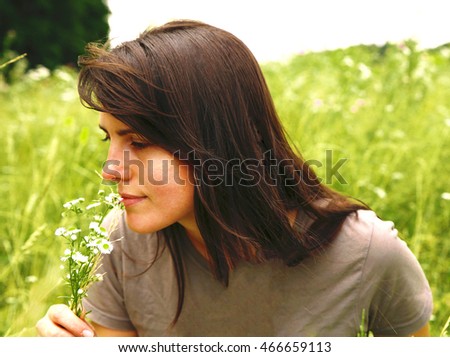  beautiful and modest girl resting in nature photo for micro-stock