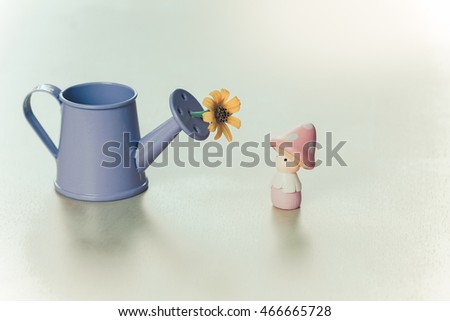 watering can have a litter flower and little mushroom girll in pink dress, Can use for card design , decoration in wedding card etc.