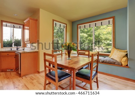 Dining area with wooden table set and cozy sitting place. Northwest, USA
