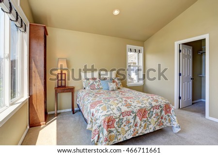 Colorful single bed in upstairs bedroom. Northwest, USA