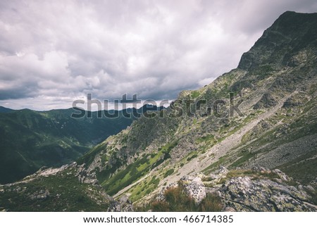Tatra mountains in Slovakia covered with clouds. summer colors - vintage film effect