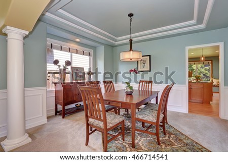 Dining room interior with mint walls and coffered ceiling. Northwest, USA