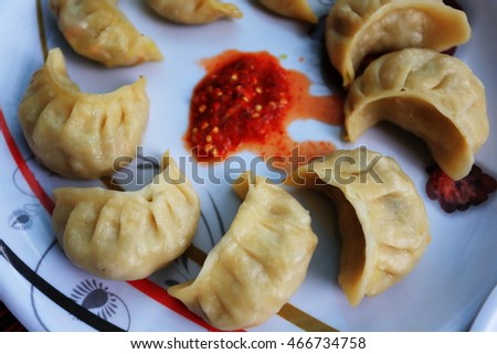 Traditional Indian food calls momo. Steamed cooked momo with sauce.