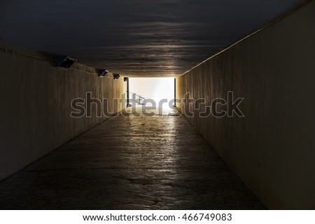 Empty underpass tunnel. The light end of the tunnel. As an abstract background for creative design interesting trash, fashion and glamor
