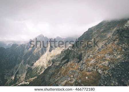 Tatra mountains in Slovakia covered with clouds. summer colors - vintage film effect