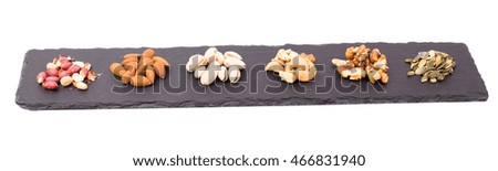 Nuts on slate isolated