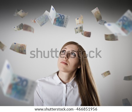 Woman in white and falling Euro banknotes. Currency and lottery concept. Young slim woman.
