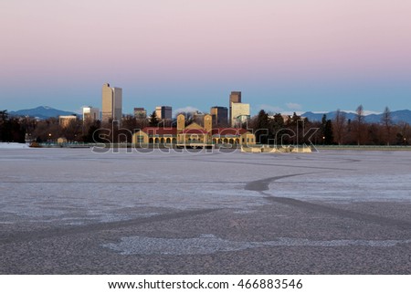 Early morning sunrise on Denver City Park in the winter with a frozen lake