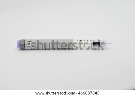 syringe with clear liquid on an isolated white background