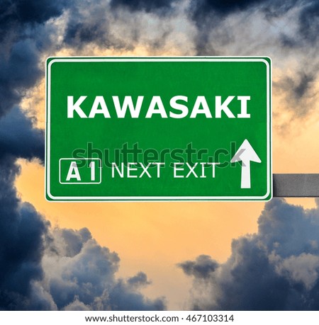 KAWASAKI road sign against clear blue sky