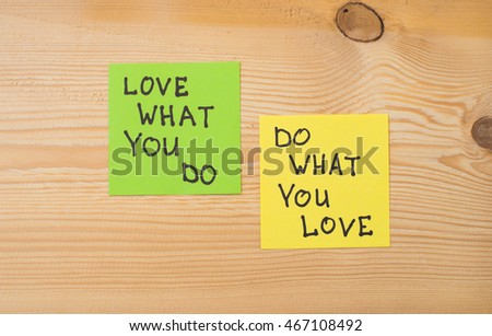 
Yellow and green note paper w on rustic wooden background. 'Love What You Do and Do What You Love' notes . I love my job concept