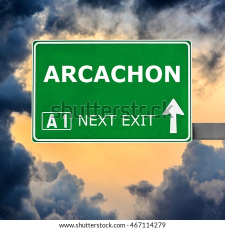 ARCACHON road sign against clear blue sky
