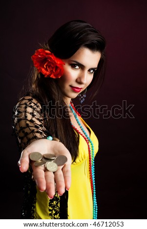 Gypsy woman with palm full of coins