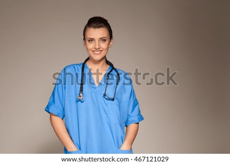 girl doctor with stethoscope in foto studio