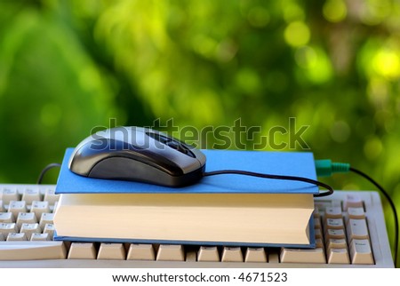A Mouse with book making one pauses.