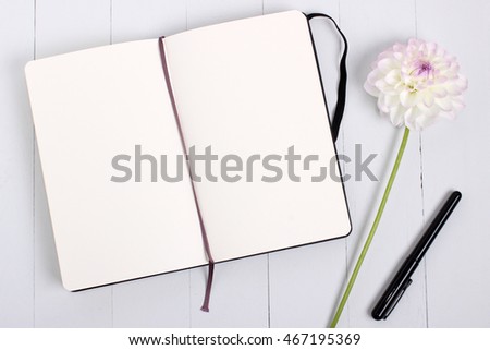 Blank Sketchbook, diary mockup with pen and flower.