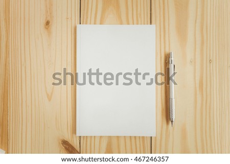 Photo blank book cover on textured wood background