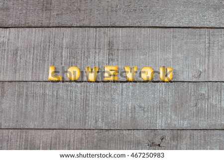 love you alphabet biscuit on wooden table, stock photo