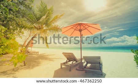 Beautiful beach. Chairs on the sandy beach near the sea. Summer holiday and vacation concept. Inspirational tropical scene. Tranquil scenery, relaxing tropical landscape design