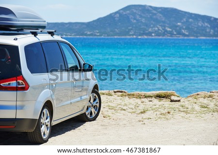 travelling. Automobile minivan view near sea beach Royalty-Free Stock Photo #467381867