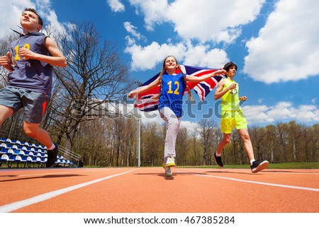 Team of three teenage sprinters with British flag
