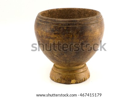 It is an old wooden mortars on a white background.