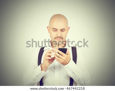 Man reading sms on your smartphone. Emotions.