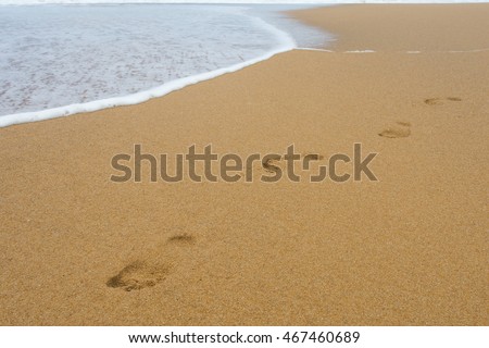 Footprint on sand on the beach.