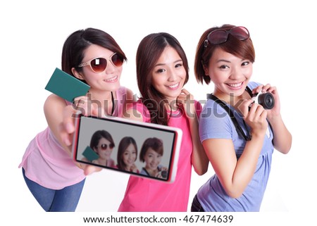 Happy teenagers woman hold camera and passport  and taking pictures by themselves isolated on white background, asian