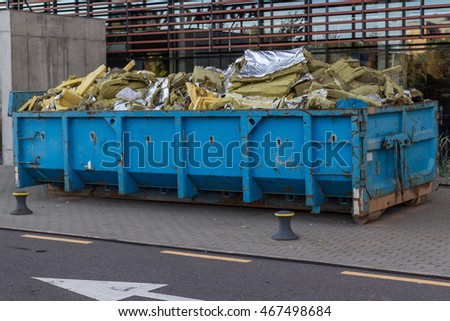 Waste container with construction waste,  Royalty-Free Stock Photo #467498684