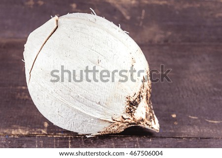 Coconut burn on old wooden background