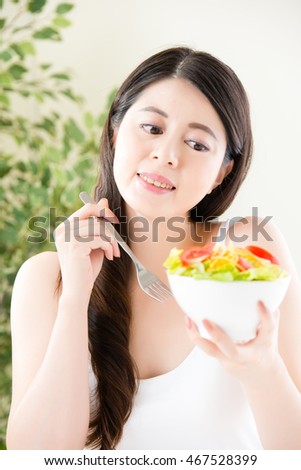 charming asian woman smile show salad, healthy food concept  indoor background