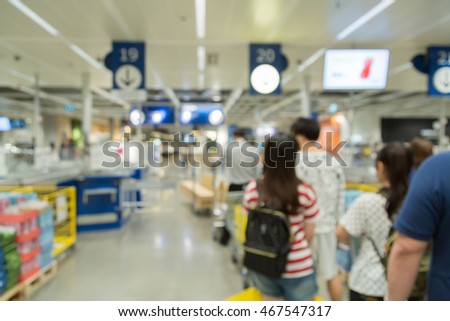 blur picture background  of customer queue for pay money at shopping counter  cashier in furniture mall 
