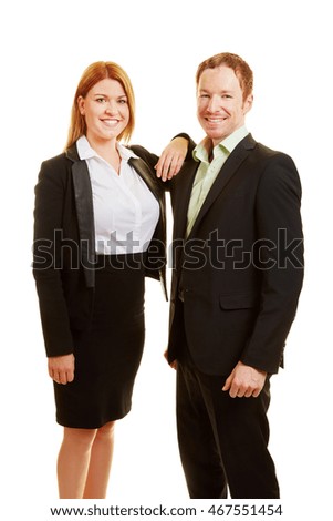Two content business people smiling as a team