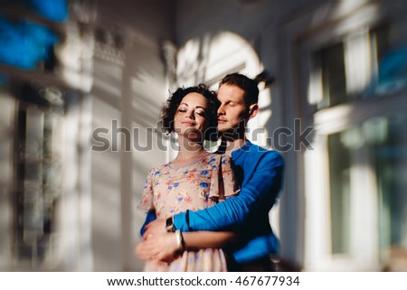 Blurred bright picture of a stylish couple daydreaming in the daylights